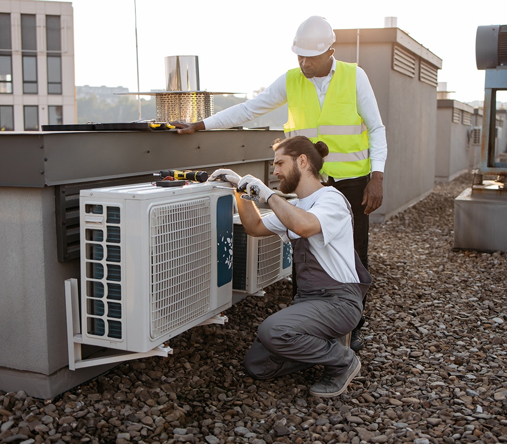 diverse plant workers repairing air conditioner on 2023 12 21 22 00 43 utc